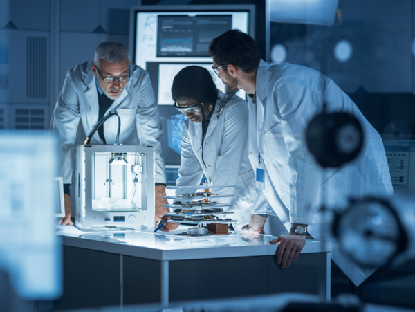 A team is working together in a technology lab