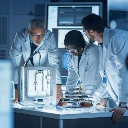 A team is working together in a technology lab A team is working together in a technology lab