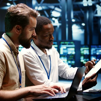 Data Center Certification Two male experts in a data center