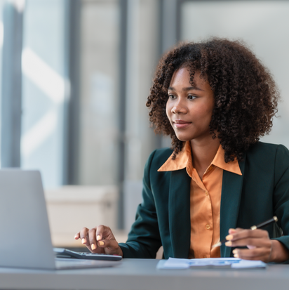 A person attending a conference or a meeting on her laptop. A person attending a conference or a meeting on her laptop.