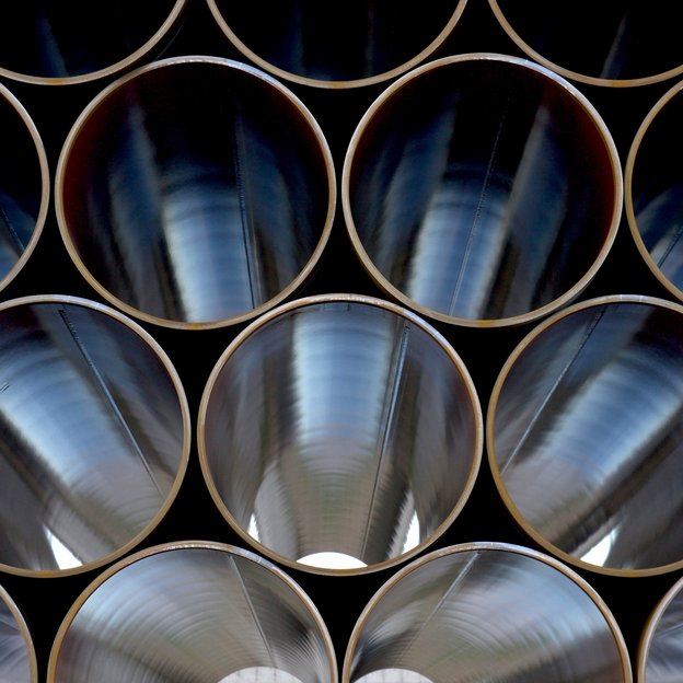 A pile of uninstalled pipes lying on top of each other.