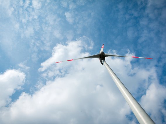 A solitary windmill with white clouds A solitary windmill with white clouds