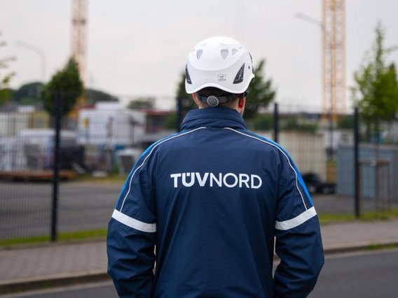 TÜV inspector looks at construction site