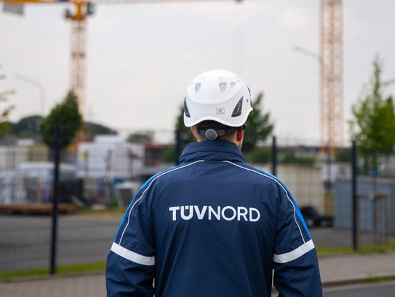 TÜV inspector looks at construction site